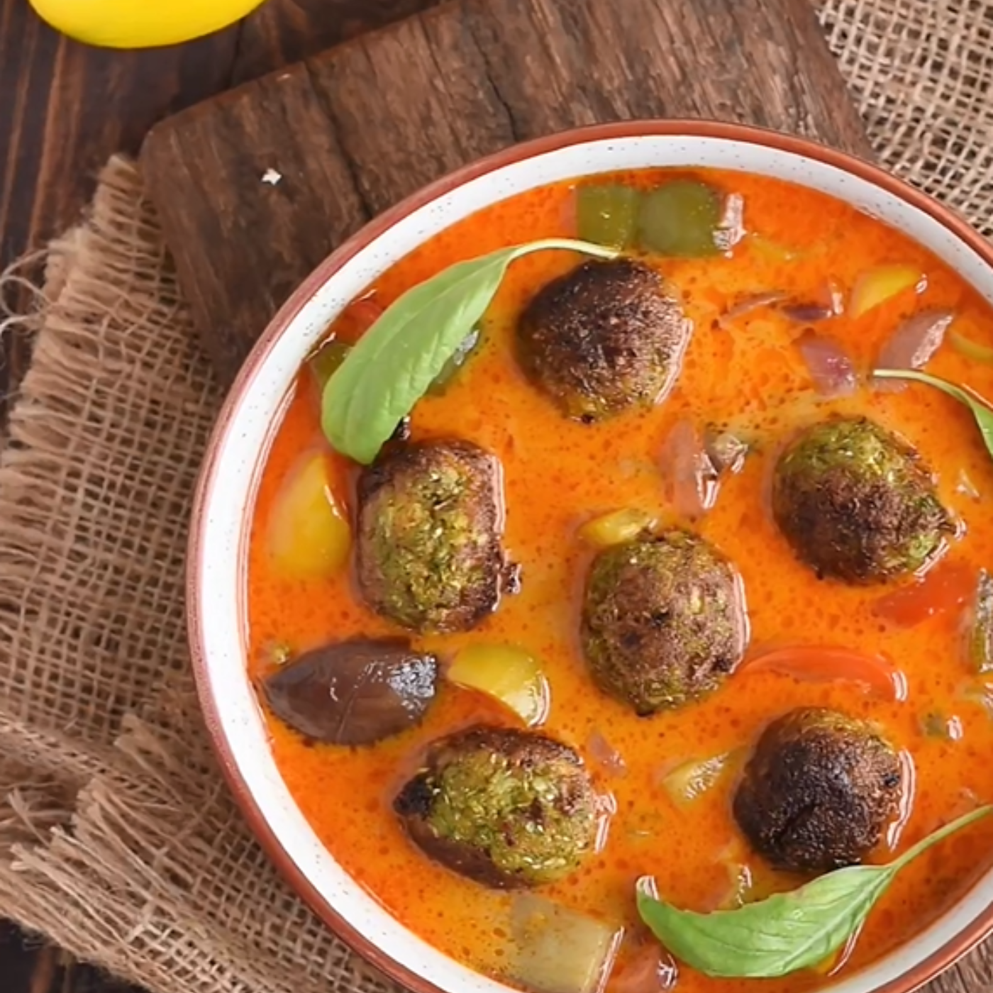 Crispy veg dumplings in flavourful and Creamy Thai Red Curry