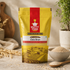 A stand-up pouch of Nutty Yogi Certified Organic Oats Bran, set on a rustic stone surface with scattered oats, a small bowl of oats, a wooden spoon, and a potted plant in the background.