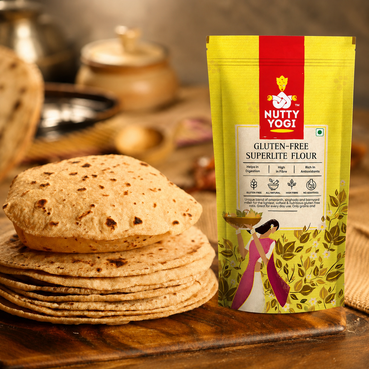 A bag of Nutty Yogi Gluten-Free SuperLite Flour stands on a wooden surface next to a stack of flatbreads, with a softly blurred kitchen background.