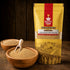 Nutty Yogi Organic Foxtail Millet Navane pack with whole foxtail millet grains in wooden bowls on a rustic wooden surface
