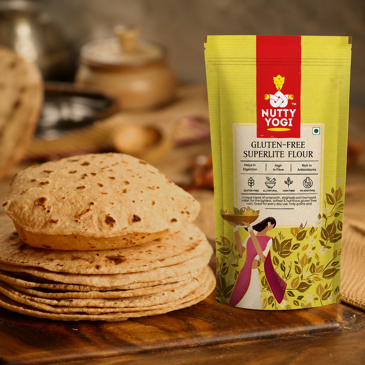 Nutty Yogi Gluten-Free Superlite Flour displayed beside freshly made rotis on a wooden board, highlighting a wholesome, gluten-free flour for everyday meals.