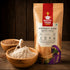 Lifestyle image of Nutty Yogi Buckwheat Flour Kuttu Atta beside a bowl of freshly milled buckwheat flour and whole buckwheat grains, showcasing a gluten free high protein and high fiber flour for healthy everyday cooking.
