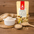 Nutty Yogi Gluten-Free Oats Flour displayed with a bowl of finely ground oat flour, whole rolled oats, and a wooden spoon, highlighting a wholesome, fiber-rich flour for everyday cooking and baking.