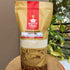 Nutty Yogi organic sona masuri rice package on a woven surface with plants in the background
