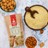 Nutty Yogi Natural Almond Flour displayed beside a bowl of almond flour and whole almonds, highlighting a premium gluten-free flour made from finely ground almonds.