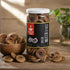 Lifestyle image of Nutty Yogi Dried Anjeer Figs jar displayed with premium dried figs in a wooden bowl, highlighting a natural source of protein, antioxidants, and digestive wellness.